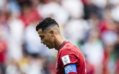 Portugal manager Roberto Martinez giving instructions to captain Cristiano Ronaldo on the pitch