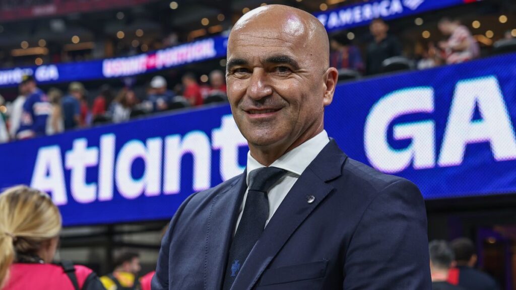 Portugal manager Roberto Martinez standing on the touchline giving tactical instructions