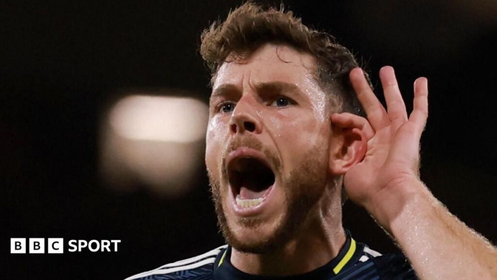 Scotland midfielder Ryan Christie looking determined in the dark blue national team jersey