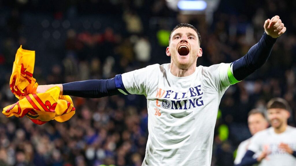 Andy Robertson wearing the dark blue Scotland captain's armband while playing in an international football match