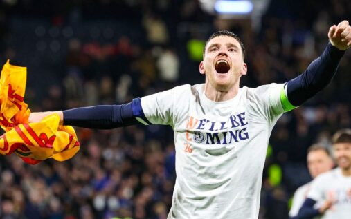 Andy Robertson wearing the dark blue Scotland captain's armband while playing in an international football match