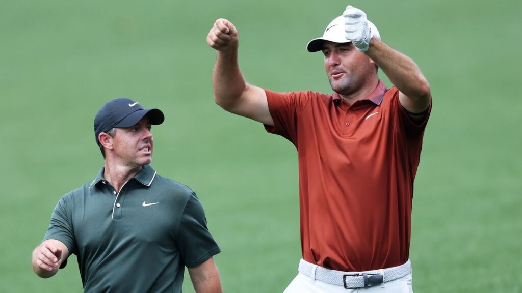 Scottie Scheffler and Rory McIlroy standing together on a golf course