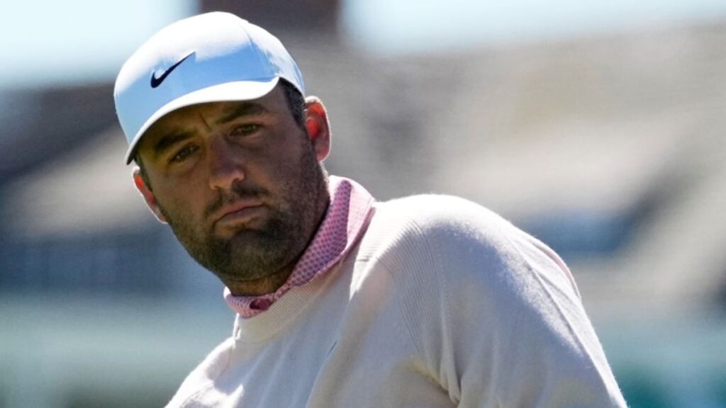 Scottie Scheffler preparing to play a shot on the golf course