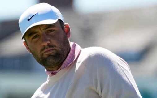 Scottie Scheffler preparing to play a shot on the golf course