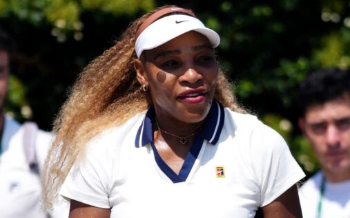 Serena Williams playing a forehand on a grass court at Wimbledon
