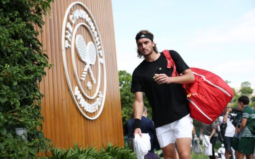 Stefanos Tsitsipas looking disappointed on a tennis court