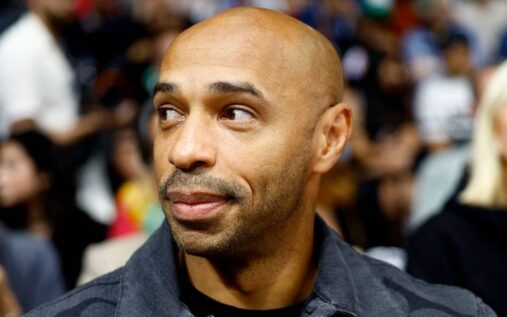 Thierry Henry looking thoughtful in a television studio while analysing international football