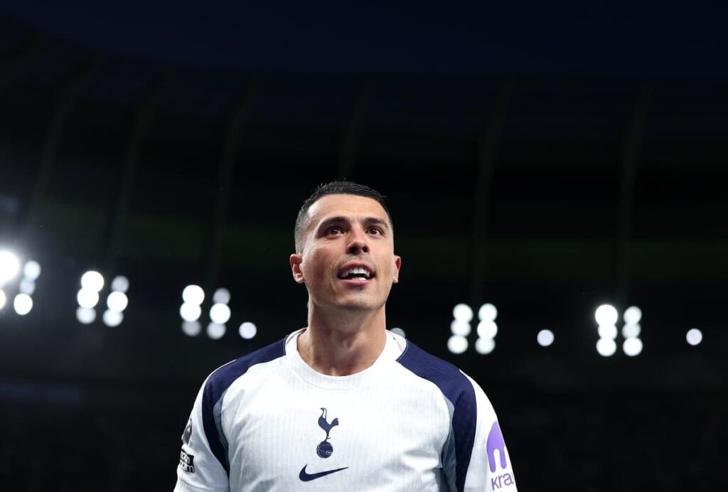 Pedro Porro in action for Tottenham Hotspur wearing the white home kit
