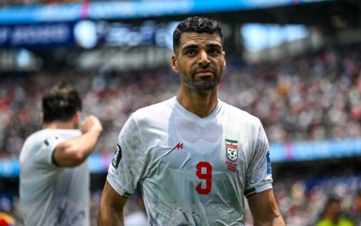Iran striker Mehdi Taremi looking serious on the pitch during a match