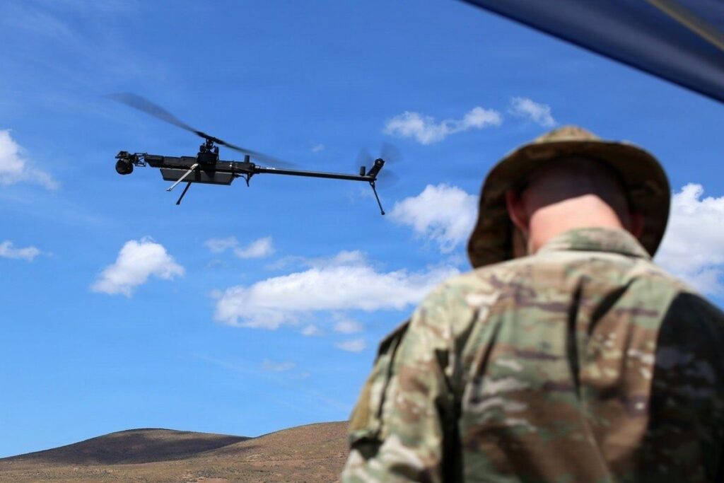 Police officers operating drone surveillance equipment outside an American stadium