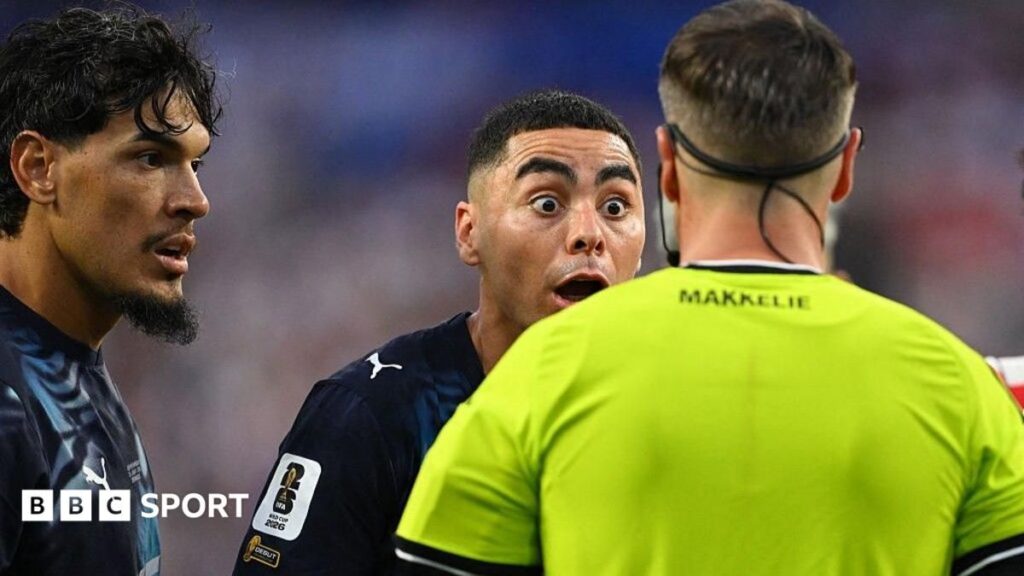 Referee Danny Makkelie reviewing a VAR pitchside monitor during a World Cup football match