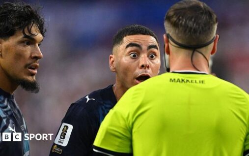 Referee Danny Makkelie reviewing a VAR pitchside monitor during a World Cup football match
