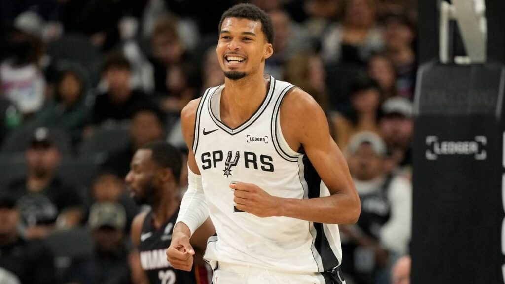 Victor Wembanyama of the San Antonio Spurs looking reflective on the basketball court