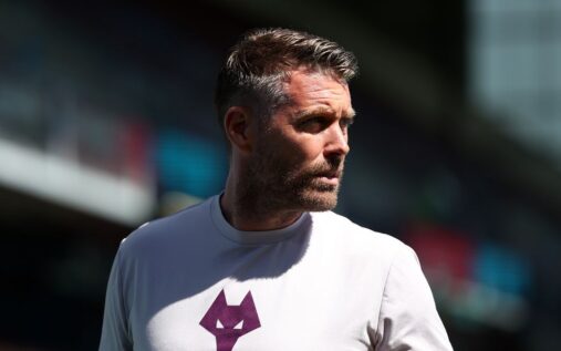 Rob Edwards standing on the touchline managing a Wolverhampton Wanderers match