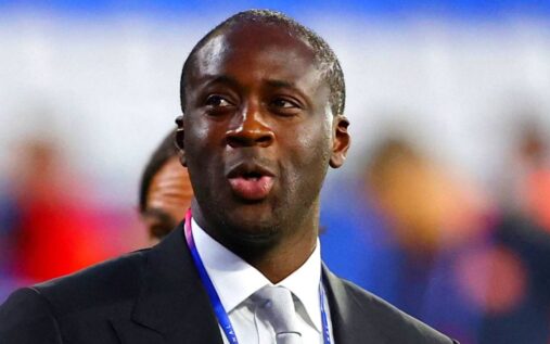 Yaya Toure standing on the touchline in coaching gear